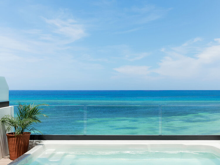 Excellence Oyster Bay Jamaica, luxury all-inclusive resort, adults-only Jamaica getaway, 40th birthday group trip, milestone birthday celebration, private beach villas Jamaica, Montego Bay luxury resort, spa retreat in Jamaica, beachfront suites, gourmet dining Jamaica, Caribbean group travel, exclusive resort experiences, personalized celebration packages, Excellence Club benefits, rooftop terrace suites, Jamaica all-inclusive birthday trip.