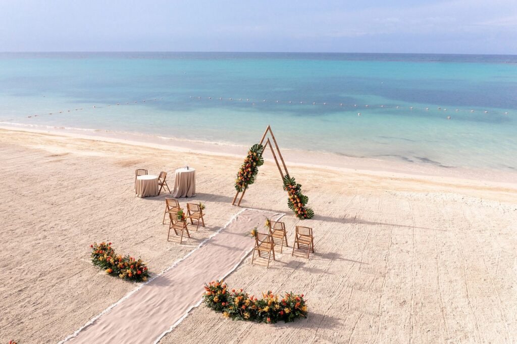 destination wedding, luxury wedding resorts, Caribbean weddings, Sandals Resorts, wedding group travel, tropical wedding, beach wedding, wedding planning, wedding group amenities, honeymoon destination, wedding photography, wedding ceremony, wedding reception, luxury travel, wedding inspiration, wedding couple, group accommodations 