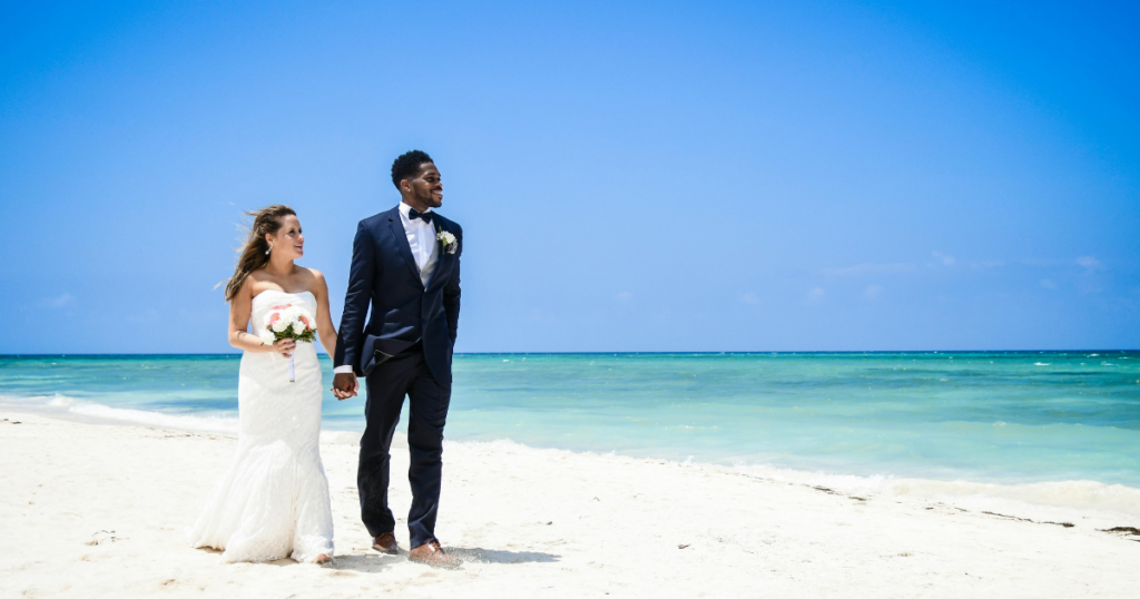 how to travel with your wedding dress, traveling with a wedding dress, destination wedding wedding dress tips, how to pack a wedding dress for flying, carrying on a wedding dress airplane, wedding dress travel tips, destination wedding planning tips, wedding dress on airplane, flying with a wedding gown, how to keep a wedding dress wrinkle free while traveling, travel garment bag for wedding dress, destination wedding bride tips, beach wedding dress travel, wedding dress packing hacks, international travel with wedding dress, TSA wedding dress tips, best garment bag for wedding dress travel, wedding dress carry on rules, destination wedding checklist bride, how to transport a wedding dress safely, wrinkle release for wedding dress travel, airport tips for brides, wedding dress steaming at resort, all inclusive destination wedding tips, Mexico destination wedding tips, Caribbean destination wedding planning, destination wedding expert advice, wedding travel essentials bride, bridal travel tips, wedding dress preparation for travel, stress free destination wedding planning, destination wedding bride guide, luxury destination wedding tips, Destinations by Amy